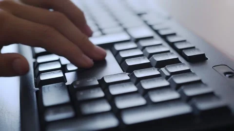 Child's fingers on keyboard using cursor keys playing. concept game on comput Stock Footage 130661496