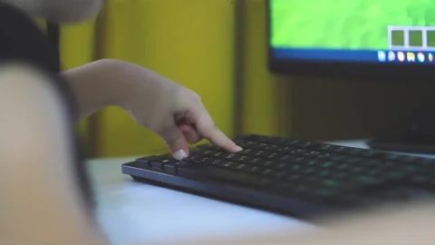 Child's hand controls computer mouse while playing. Stock Footage 220787191