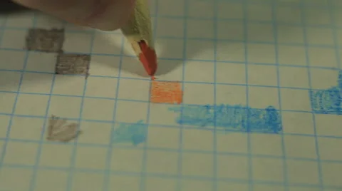 The child's hand draws the orange square Stock Footage 47068515