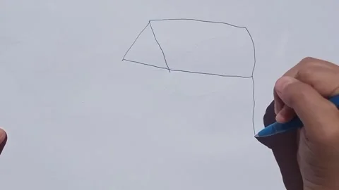 Child's hand learning to draw a simple house sketch with a blue pen. Stock Footage 313728895