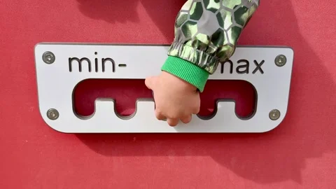 A childs hand moves the control from minimum to maximum. Stock Footage 347551603