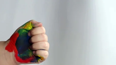 Child's hand in the paint Stock Footage 70978998