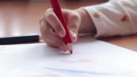 Child's hand with a pencil close-up, selective focus Stock Footage 253545351