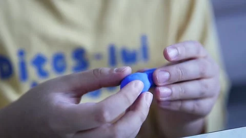 A child's hand playing with clay Stock Footage 304271733