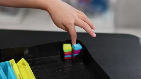 Childs hand playing with letter blocks. San Francisco CA USA May 10 2026 Stock Footage 336296061