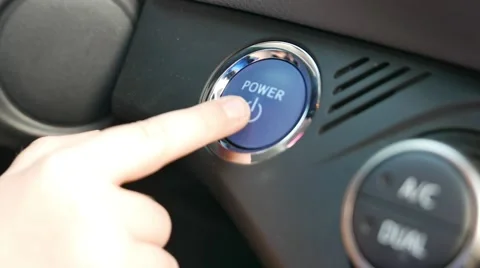 Child's hand presses the button to turn on the car Stock Footage 62653605