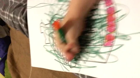 Child's hand randomly draws with a felt-tip pen in an album Stock Footage 153365754