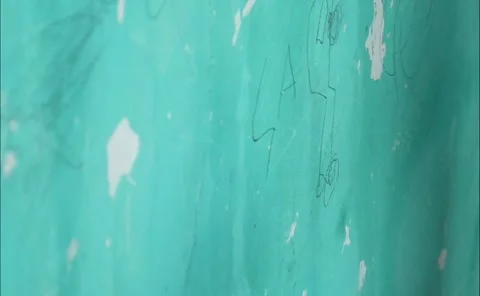 A Childs hand scribbles on a green wall 스톡 동영상 324941389