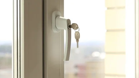 Child's hand on secure window handle Видео 75731101