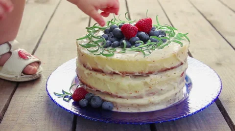 Child's hand takes berries Video stock 61249845
