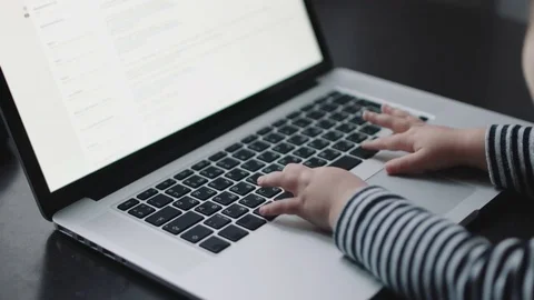 Child's hand touching laptop keyboard 스톡 동영상 70819490