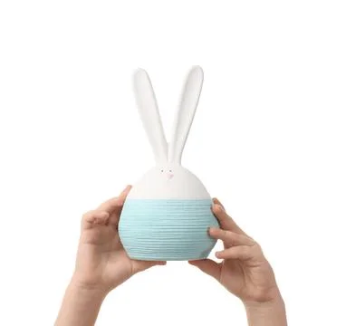 Child's hands with Easter bunny toy on white background Stock Photos