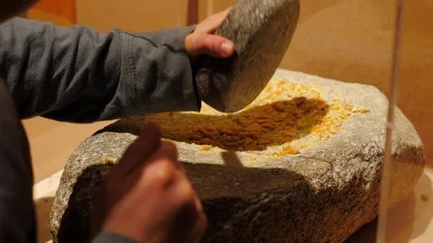 Childs hands grinding corn into flour 스톡 동영상 102250295
