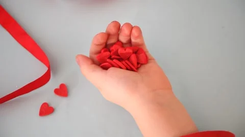 Child's hands holding heart candy in a hand. Valentines and Mother day concept. Stock Footage 145122080