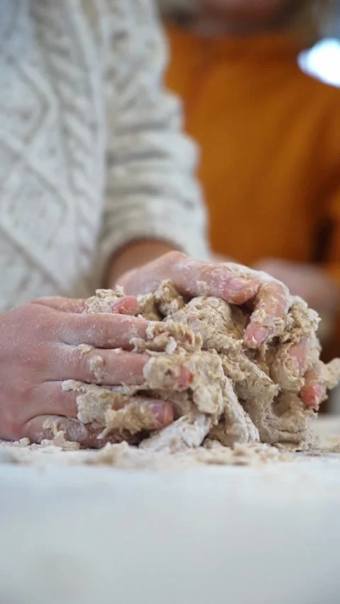 Child's hands kneading a bread dough Stock Footage 255017720