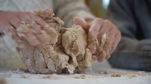 Child's hands kneading bread dough Stock Footage 255376821