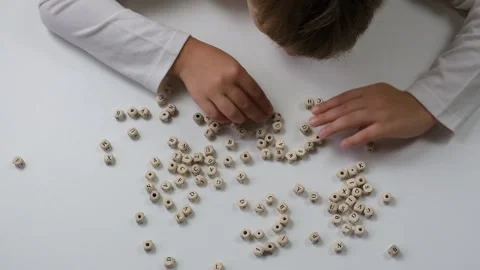 Child's hands lay out letters. Back to school soon Stock Footage 201628625