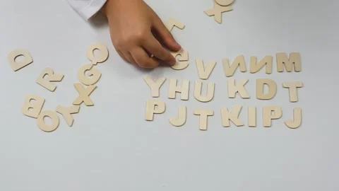 Child's hands lay out letters. Back to school soon Stock Footage 201628628