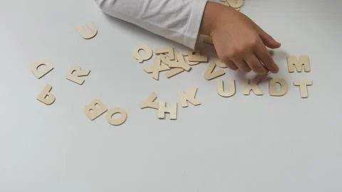 Child's hands lay out letters. Back to school soon Stock Footage 201628629