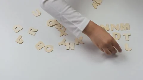 Child's hands lay out letters. Back to school soon Stock Footage 201628630