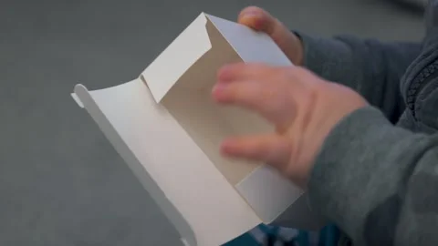 Child’s Hands Opening Small White Box Stock Footage 325948279