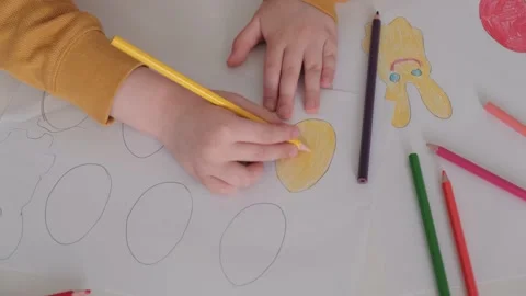 Child's hands paint an Easter egg Stock Footage 148787659