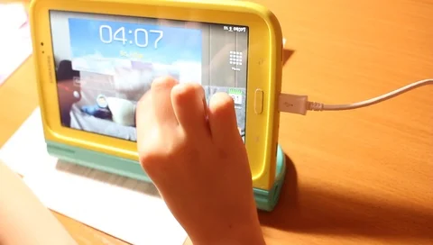 Child's palm counts the numbers on the tablet, close-up Stock Footage 100264274