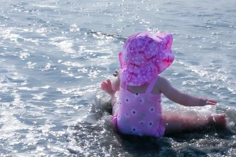 Child's Play by the Ocean Stock Photos