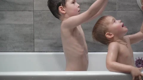 Childs playing in the bath with soap bubbles. Stock Footage 331254079