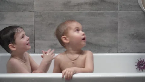 Childs playing in the bath with soap bubbles. Stock Footage 331254093