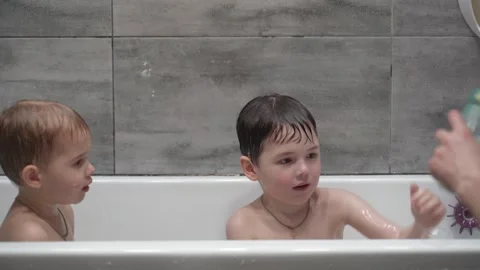 Childs playing in the bath with soap bubbles. Stock Footage 331254124