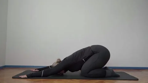 Child’s Pose Stretch for Lower Back Pain Relief on Floor Mat Stock Footage 340884005