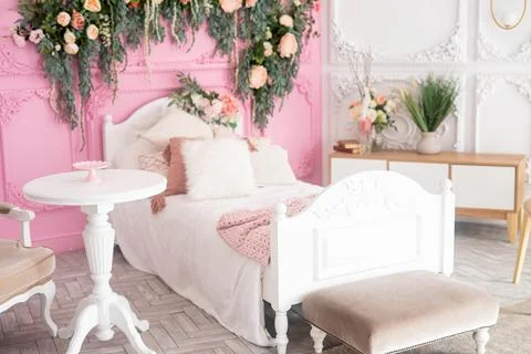 Child's room interior with comfortable bed and garland Stock Photos