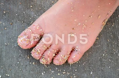 A child's sandy foot Stock Photos