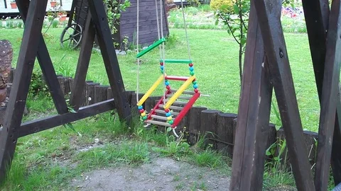 The child's swing swings. Stock Footage 76596258
