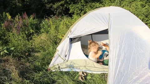 Childs in tent Stock Footage 77507994