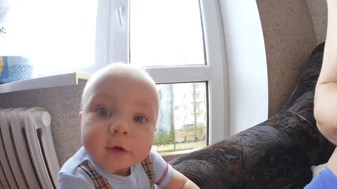 A child's view of the camera close up shot. The child tries to lick the lens Video stock 84576265