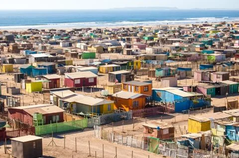 Chile, High angle view of multi colored huts on beach Stock Photos