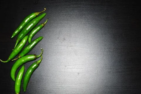Chile serrano or serrano chilis in a black background, ingredients for Mexica Foto stock
