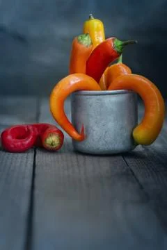 Chili pepper in a Cup on the table 写真素材