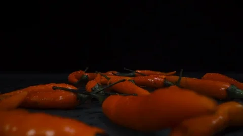 Chili pepper on a dark background. Camera zoom in on a dark background. Video stock 125476411