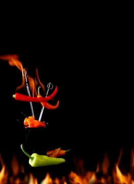 Chili pepper on fire Stock Photos