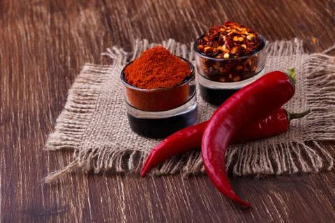 Chili peppers on rustic background Stock Photos