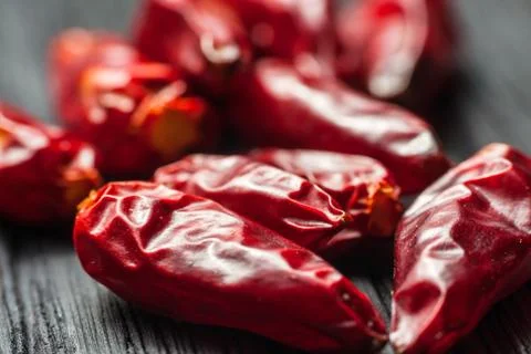 Chili peppers on a table Stock Photos