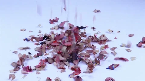 The chill falls from the sharpened pencil. small pieces of pencils fall Stock Footage 140759734