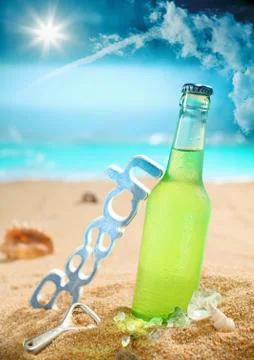 Chilled beer on the beach Stock Photos
