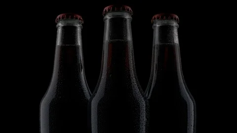 Chilled  bottles of drinks isolated on black background Stock Footage 125256287