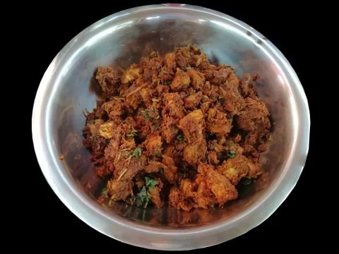 Chilli Chicken curry served in a large bowl Stock Photos