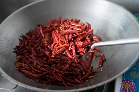 Chilli dry in the pan Stock Photos