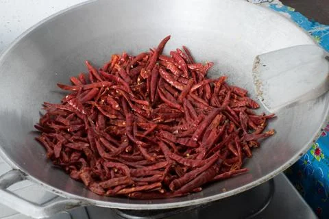 Chilli dry in the pan Stock Photos